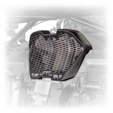 Laser cut aluminum vent panel aligned to grille frame