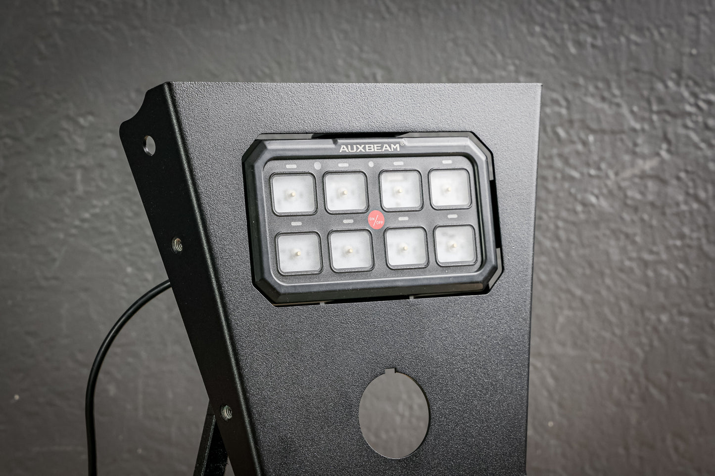 Auxbeam XL 8 Gang Mount by StayFlush Motorsports, shown with mounting hardware and electrical connectors for off-road lighting.