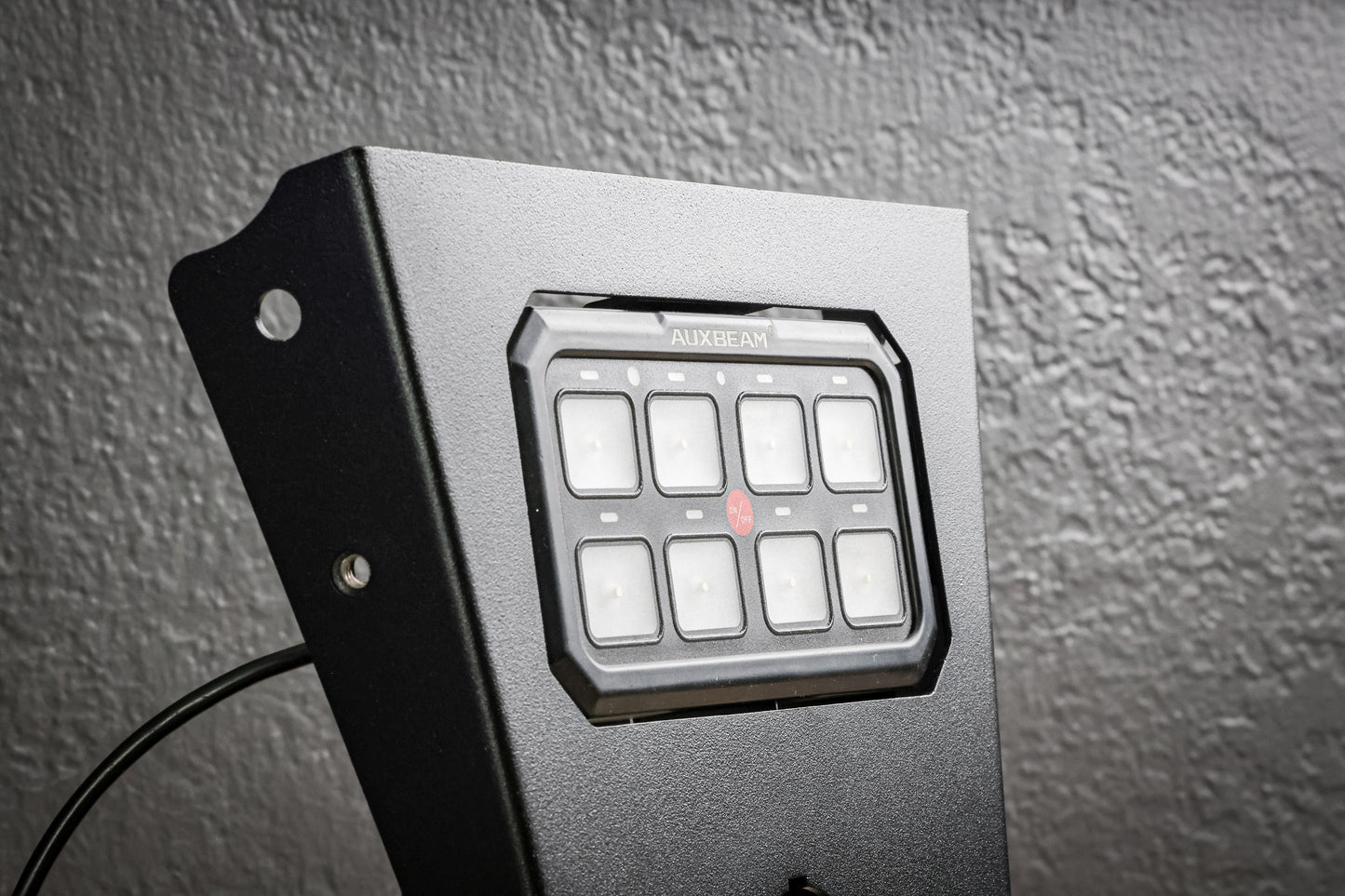 Auxbeam XL 8 Gang Mount by StayFlush Motorsports, sturdy black mounting bracket with multiple switch slots for auxiliary lights.