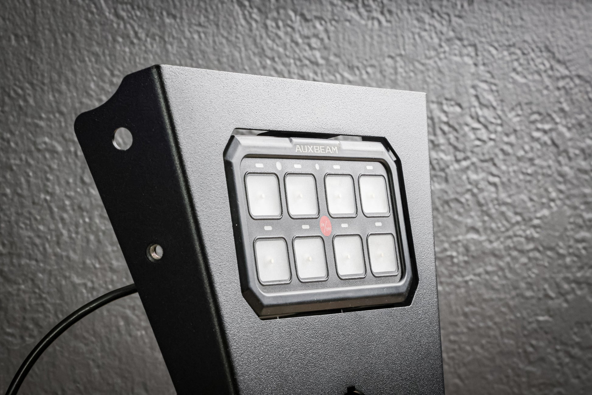 Auxbeam XL 8 Gang Mount by StayFlush Motorsports, sturdy black mounting bracket with multiple switch slots for auxiliary lights.