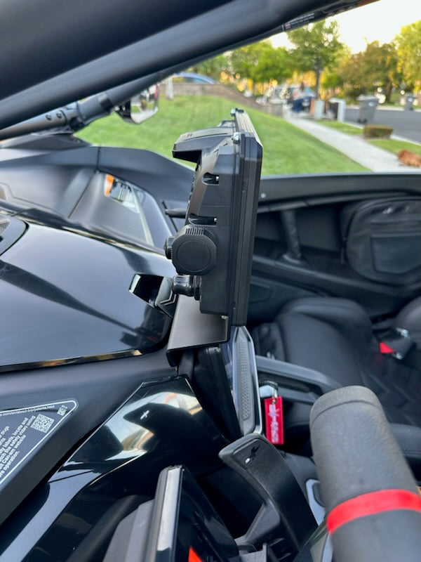 StayFlush Motorsports SFM MaverickR GPS mount attached to a vehicle dashboard, showcasing secure mounting and sleek design.