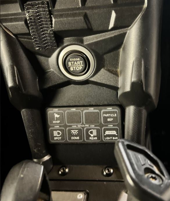 StayFlush Motorsports SFM SwitchPro8 CanamX3 console lower plate mounted on the vehicle's interior.