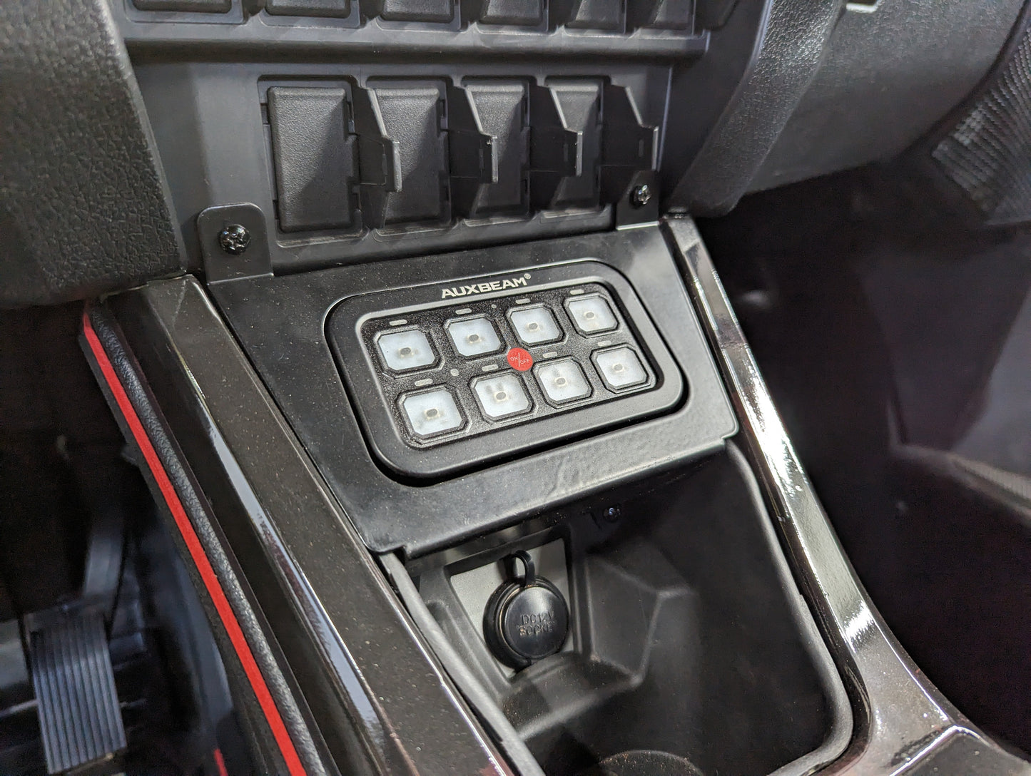 StayFlush Motorsports SFM Pro/R Auxbeam 8 Gang mount with multiple switch slots on a black mounting panel.