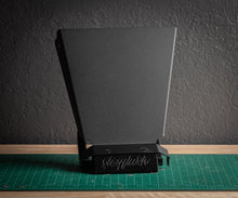 StayFlush Clean Slate CanamX3 console in black, showcasing the sleek, durable design with mounting points and textured finish.