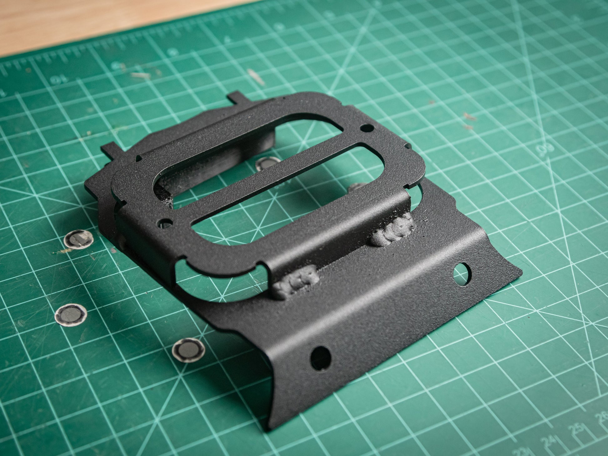 CanamX3 console with StayFlush X3 Lower 6-Gang Auxbeam mount for off-road vehicles, showing durable black mounting hardware.